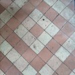 a brick floor with a tile floor